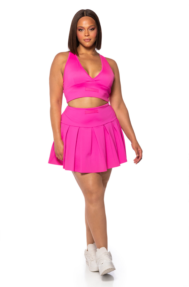ITS THE PAXTON LUXE PLEATED SKORT IN NEON PINK